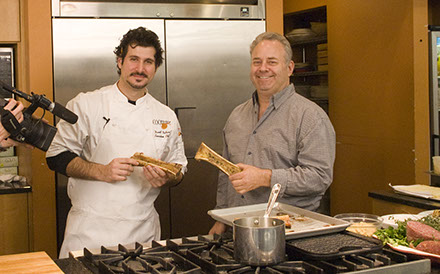 Simon Feldman on a food set with a chef